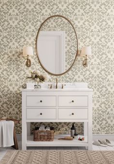 a bathroom with a vanity, mirror and rug