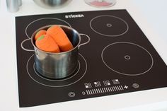 there are carrots in a pot on the stove