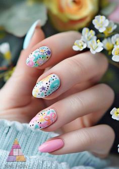 Fresh and floral, these nails feature a delicate blend of pastel polishes and springtime motifs. Cultivate your nail art garden by visiting NailHow.com for more floral designs. Nail Printer, Funky Nail Designs, Easter Nail Designs, Nail Art Studio, Dotting Tool, Easter Nails, Pastel Nails, Art Garden