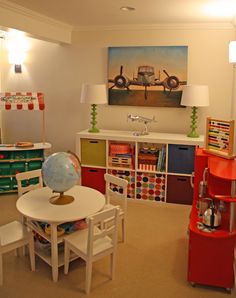 the room is clean and ready to be used as a playroom for toddlers