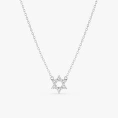 Adara This delicate necklace features a tiny Star of David pendant shimmering with sparkling diamonds. The Star of David is a cherished symbol of Judaism and Jewish identity. This necklace is a meaningful way to express your faith or heritage in a subtle and stylish way. - Handmade- Solid Gold- Natural Diamonds - G Color, SI Quality Diamonds- Total Diamond Carat Weight: 0.10 ctw- Star Size: 8 mm All pieces come beautifully boxed in suede pouches you can always use when traveling! Star Of David Necklace, Bat Mitzvah Gifts, Star Of David Pendant, Lois Lane, Butterfly Effect, Tiny Star, Diamond Star, Diamond Carat, Star Of David