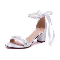 a women's white high heeled sandal with pearls