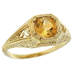 Add a delicate and unique aesthetic to your hand with this filigree ring by GEMMA FILIGREE. Our antique design gold filigree rings equate to delicacy and light openwork, while maintains strength for everyday wear for a lifetime. This striking filigree design ring with floral and leaf motif is a symbol of growth and femininity, encompassing a beautiful meaning for the wearer. CHARACTERISTICS Status: Made to order Origin: Thailand Metal: Solid 9K Yellow Gold Ring Size: US 3-8 Total Gemstones Weigh Luxury Yellow Gold Filigree Ring With Intricate Design, Antique Rings Gold 1stdibs, Vintage Jewelry Rings 1stdibs, Citrine Engagement Ring Vintage, Yellow Stone Engagement Ring, Filigree Rings, Symbol Of Growth, Citrine Ring Engagement, Filigree Ring Gold