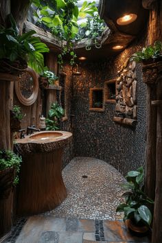 a bathroom with a tree stump sink in the middle and lots of greenery on the walls