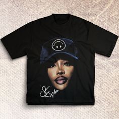 SZA SOS Big Face Tshirt | High Quality | Vintage Hip Hop Retro Style 90s Tee This shirt is crafted from 6 oz. of 100% USA-grown cotton, offering a premium and durable build across all our standard colors. For a slight variation, our Heather Grey option blends 90% USA cotton with 10% polyester, ensuring a soft touch with a hint of stretch. Additionally, the Charcoal Grey, Safety Green, and Lime variants present a perfect 50/50 mix of USA cotton and polyester, combining comfort with resilience. Shipping Information Wondering about the arrival of your order? Here's what you need to know: It typically takes 3 to 5 days for us to process and prepare your order for shipment. After your package has been dispatched, changes to the shipping method or speed are not possible from our end. Rest assure 90s Graphic Print T-shirt For Streetwear, 90s Inspired Short Sleeve Screen Print T-shirt, 90s Inspired Cotton T-shirt With Screen Print, Hip Hop Cotton Crew Neck Top, Hip Hop Style Cotton Crew Neck Tops, Cotton Crew Neck Hip Hop Tops, Trendy Cotton T-shirt For Streetwear, Hip Hop Cotton Crew Neck Shirt, 90s Inspired Letter Print T-shirt For Streetwear