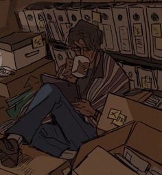 a man sitting in a pile of boxes with his feet up on the floor while reading a book