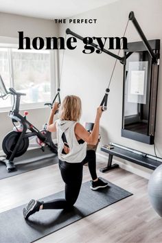 a woman is doing exercises on the exercise mat in front of a window with text overlay that reads, the perfect home gym