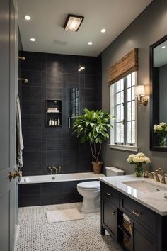 a bathroom with a toilet, sink and bathtub next to a window in it