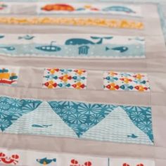 a quilted table runner with different designs on it