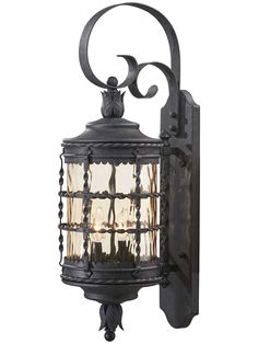 an old fashioned wall light with glass panels