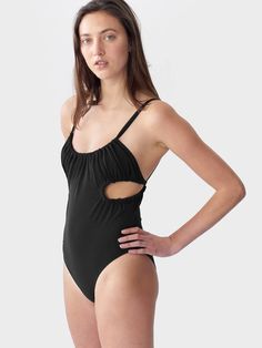 A playfully modern one-piece suit featuring a ruched neckline, cutouts at the sides and fully adjustable straps that tie in the back. Content: 72% Polyamide, 28% Elastane Made in the USA Swim fabric is rated UPF 50+ ensuring high UV protection Black colorway shown for fit Chic Ruched Swimwear For Summer, Chic Sleeveless Swimwear With Ruched Sides, A Way Of Life, One Piece Suit, Upf 50, Uv Protection, Swimming, One Piece