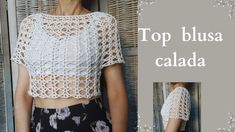 the top blouse is crocheted with flowers and has short sleeves that are open