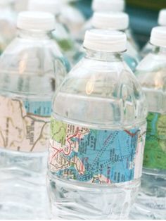 several bottled water bottles with maps on them