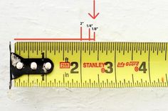 a measuring tape with two black handles on it