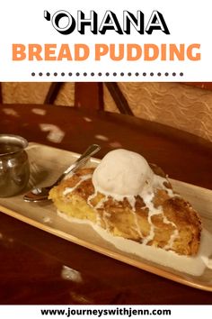 a piece of bread pudding with ice cream on top is sitting on a wooden tray