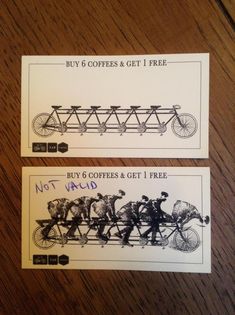 two coupons for coffee and free bikes on a wooden table with the words buy 6 coffees & get 1 free