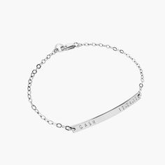 "Our minimal, modern and beautifully made sterling silver name bar bracelet, makes the perfect new mom bracelet! Personalize the bar to never be far from the one you love with a 'name and date' as shown, or personalize in your own way. We can hand stamp the bar with up to 18 characters on the front side, including: numerals, letters, the period mark, an ampersand, a hashtag, and heart. (Back stamping is available by special request). We use a heavy gauge metal to create all our nameplates which Minimalist Stainless Steel Name Jewelry, Custom Name Silver Jewelry For Everyday, Silver Custom Name Jewelry For Everyday, Everyday Stainless Steel Nameplate Jewelry, Dainty Engraved Bracelet For Everyday Wear, Dainty Engraved Bracelets For Everyday, Dainty Engraved Bracelets For Everyday Wear, Dainty Everyday Engraved Bracelets, Minimalist Stainless Steel Name Bracelet