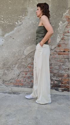 "This wide leg linen pants are perfect fit for the warm months of the year. The men style trousers has two side pockets and hook fly closer. On the back, there are two decorative pockets. ✥ Welcome to my world! I create my design in my dreams and I draw geometric lines and extravagant patterns with scissors, needles and thread. Be my dream catcher and let me create for you a parallel fashion world! ✥ SHIPPING Express shipping: 2-3 biz days via DHL Worldwide ✥ SIZING The model in the picture wear Summer Khaki Straight Dress Pants, Khaki Straight Dress Pants For Summer, Casual Beige Full-length Dress Pants, Casual Linen Dress Pants, Loose Fit Full Length Khaki Pants, Khaki Wide Leg Cargo Pants, Khaki Straight Cargo Pants, Beige Linen Full-length Bottoms, Beige Linen Full Length Bottoms