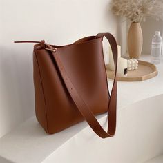 Features: Discover the style and convenience of this Nataly shoulder bag set. With its 2-in-1 design and large capacity, this high-quality tote bag is perfect for any occasion. Crafted from soft, pure-color materials, it is both durable and comfortable to wear. Enjoy the luxury of a genuine designer handbag without sacrificing practicality or elegance. Brown Solid Color Hobo Bag For Shopping, Trendy Brown Solid Color Hobo Bag, Square Leather Shoulder Bag In Solid Color, Versatile Leather Shoulder Bag In Solid Color, Versatile Solid Color Leather Shoulder Bag, Solid Color Square Shoulder Bag For Daily Use, Casual Leather Hobo Bag In Solid Color, Solid Color Square Shoulder Bag For Everyday, Brown Solid Color Bucket Bag For Shopping