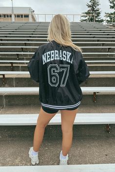 Get ready for game day with this new FSB exclusive- the Nebraska 1867 Varsity Jacket! Available in small-xl Model is wearing size XL Black Team Outerwear For Sports Events, Sporty Black Outerwear With Team Name, Game Day Varsity Jacket With Team Name, Game Day Long Sleeve Varsity Jacket With Team Name, Varsity Jacket With Team Name For Game Day, Team-colored Collegiate Outerwear For Sports Events, Black Team Spirit Outerwear For College, Team-colored Long Sleeve Track Jacket For Game Day, Black Team Spirit Outerwear For Sports Events