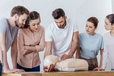 Stock Image: group of concentrated people with cpr dummy during first aid training class Pals Algorithm, Cna School, Advanced Cardiac Life Support, Cardiopulmonary Resuscitation, Education Certificate