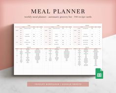 the meal planner is shown on top of a marble table with pink and white walls