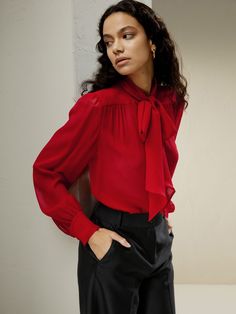 A contemporary rendition of a delectable classic, we reimagined the timeless pussycat bow blouse in a sheer silk georgette. The pinnacle of sultry and chic, the bow is fastened neatly at the neck for added sophistication. Style with a camisole underneath for a business casual look, or wear under a structured blazer and let the feminine bow peek from underneath. Mesh Bows, Bow Tie Blouse, Summer Wardrobe Essentials, Mesh Shirt, Casual Evening, Bow Blouse, Tie Neck Blouse, Tie Blouse, Effortless Chic