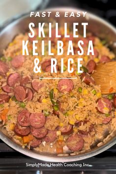 a skillet filled with rice and sausage