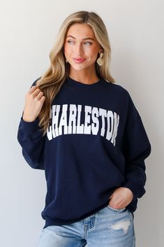 Calling all Charleston residents, the Navy Charleston Sweatshirt was made just for you! This comfy sweatshirt is designed with a soft and stretchy knit with a fleece interior. It features a crew neckline, long sleeves, a relaxed fit, and the word "Charleston" on the front. Style the Navy Charleston Sweatshirt with your favorite denim and sneakers for a casual look! Soft + Stretchy Knit Fabrication Fleece Interior "Charleston" Graphic Crew Neckline Long Sleeves Relaxed Fit 80% Cotton, 20% Polyest Cute Boutiques, Comfy Sweatshirt, The Navy, Large Bust, Navy Color, Casual Look, Small Bust, Charleston, Boutique Clothing