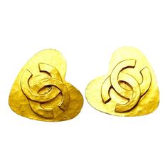 This is part of Chairish’s Costume Jewelry assortment.  Chanel Vintage Gold Plated CC Heart Clip on Earrings  *Marked 95 *Made in France *Comes with the original box  -It is approximately 1.25" x 1.25". -This is a very iconic vintage Chanel item. -In a very good  vintage condition. Chanel Stud Earrings, Pink Stud Earrings, Heart Clip, Ruby Earrings Studs, Blue Stud Earrings, Gold Diamond Earrings Studs, Handmade Clay Earrings, Pink Studs, Van Cleef And Arpels