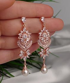 Romantic crystal drop earrings. Gorgeous wedding earrings for a bride or bridesmaids. Matching necklace and bracelet will complete your wedding jewelry set. This bridal jewelry set is available in silver, gold or rose gold color to match your dress. Earrings measure about 2 1/4" long and 1/2" wide. Matching regular bracelet is measuring 7" long and 1/4" wide. Extension is available if you have a larger wrist. Adjustable bracelet with strings is available as well for a larger wrist. High quality guaranteed by Latasha Bridal! Rose Gold Drop Bridal Earrings For Anniversary, Rose Gold Cubic Zirconia Drop Bridal Earrings, Rose Gold Crystal Dangle Chandelier Earrings, Rose Gold Crystal Chandelier Dangle Earrings, Rose Gold Cubic Zirconia Bridal Earrings For Wedding, Rose Gold Cubic Zirconia Dangle Bridal Earrings, Rose Gold Drop Crystal Earrings For Wedding, Rose Gold Crystal Drop Bridal Earrings, Rose Gold Crystal Bridal Earrings For Gift