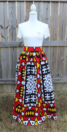 Beautiful Handmade 100% cotton African Maxi Skirt in a gorgeous vibrant 100% cotton African print with 2 1/2 inch high waistband. Made to Order, please measure your waist for a perfect fit. Features: Knee Length 24 inches Maxi Length 44 inches * Lined * 2 Side Pockets * Back zip closure Important info on sizing: All items are created custom to your measurements. Fit is very important for these skirts to fit correctly so I will need your natural waist measurement. This is taken above the belly bu Red Cotton Long Skirt, Red Cotton Lined Maxi Skirt, Red Cotton Maxi Skirt With Lining, Red Cotton Midi Skirt, Red Pleated Cotton Maxi Skirt, Fitted Multicolor Cotton Maxi Skirt, Fitted Red Cotton Maxi Skirt, Red Fitted Cotton Maxi Skirt, Bohemian Cotton Skirt With Pockets