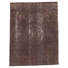 an antique rug with faded brown and white colors on the bottom, it is made from wool