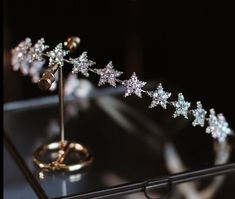 a diamond tiara on display in a glass case