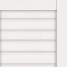 a closed window with white blinds on it