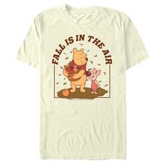 Take a stroll with Christopher Robin through Hundred Acre Woods this fall and join all your favorite classic characters in this officially licensed Disney Winnie the Pooh Fall is in the Air Men's Graphic T-Shirt! This adorable design features Winnie the Pooh and Piglet gathering apples with leaves falling around them, along with the phrase: "Fall is in the air" printed in brownish lettering across the front. Show off your love for Winnie the Pooh while you dress in style this season! Fall Crew Neck T-shirt For Disney Fan Events, Disney T-shirt With Cartoon Print For Fall, Disney Character Print T-shirt For Fall, Disney Fan Merchandise T-shirt For Fall, Graphic Print T-shirt For Disney Fan Events In Fall, Casual T-shirt For Disney Fan Events In Fall, Disney Letter Print T-shirt For Fall, Winnie The Pooh Fall, Winnie And Piglet