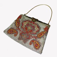 "Item: This is a great micro bead handbag woven with a fun paisley design. The frame and clasp have a leaf and branch motif and are studded with marcasites. The beads are all metallic in red, gold, silver, copper and aqua blue colors. I've been over this with a magnifying glass and can't find a single missing bead. This has a cream satin lining which has some staining and the chain is a vintage replacement. The purse is in very good condition overall. Be sure to Favorite this piece and check our Embroidered Tapestry Bag In Rectangular Shape, Multicolor Bohemian Bags For Formal Occasions, Handmade Tapestry Evening Bags, Handmade Tapestry Bags For Evening, Bead Handbag, Aqua Blue Color, Top Handle Bags, Beaded Handbag, Paisley Design