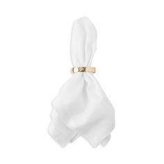 a white napkin with a gold ring on it