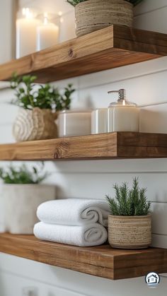 bathroom shelves with towels and candles on them