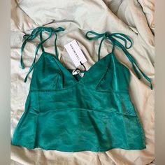 Nwt, Perfect Condition, Bow Tied Straps, Satin Material, Women’s X-Small Can Fit A Small Or Medium, Beautiful Teal Color. Chic Green Tops With Tie Waist, Sleeveless Fitted Tops With Tied Details, Sleeveless Tied Fitted Tops, Casual Party Tops With Tie Straps, Fitted Sleeveless Tied Tops, Fitted Tops With Tie Waist For Brunch, Fitted Tie Waist Top For Brunch, Fitted Top With Tie Waist For Brunch, Green Tops With Tie Straps For Day Out