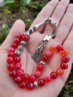 ✔️ This customized rosary made of 8 mm round cut Madagascar Red Agate beads. ✔️ This is a elegant and striking Memorial Aqeeq Tasbih. ✔️ Each order comes in a special box. ✔️ PLEASE CLICK THE LINK FOR ALL PRAYER BEADS MODELS https://www.etsy.com/shop/GoodJewelsofYazmasal Note: As a natural feature the stones beads may have some variations. SHIPPING: United States (Standart/DHL eCommerce/usps): 7-10 business days United States (Express/FedEx): 3-5 business days Canada (Express/FedEx): 4-6 busines Traditional Adjustable Agate Beads, Traditional Agate Beaded Bracelets Gift, Traditional Agate Beaded Bracelet Gift, Traditional Agate Beads And Cabochons For Gifts, Spiritual Red Beads, Gems, And Cabochons For Gifts, Polished Beads For Gifts And Festivals, Red Agate Beads, Gems, And Cabochons For Gifts, Traditional Gemstone Beads Rosary As Gift, Traditional Agate Beads As Gift