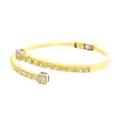 The focal point of the bracelet is the presence of 22 cushion-cut yellow diamonds, with an impressive total weight of 4.70 carats. These diamonds, arranged along the ends of the cuff, showcase the distinctive cushion-cut shape, known for its softened corners and romantic appeal. Complementing the two end cushion-cut yellow diamonds are 32 brilliant round diamonds, with a combined weight of 0.11 carats. 22 Cushion Cut Yellow Diamonds (4.70CT) 32 Brilliant Round Diamonds (0.11CT) 18KT Yellow Gold Luxury Yellow Gold Cuff Bracelet With 17 Jewels, Luxury Yellow Gold Bracelets With Sparkling Stones, Luxury Yellow Gold Round Cuff Bracelet, Luxury Yellow Gold Diamond Bracelet For Evening, Luxury Yellow Bracelet For Festive Occasions, Luxury Yellow Gold Cuff Bracelet With Single Cut Diamonds, Luxury Adjustable Yellow Gold Diamond Bracelet, Luxury Yellow Gold Wedding Bracelet, Luxury Yellow Gold Leather Bracelet Gift