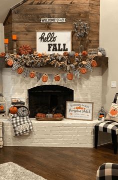 a fireplace decorated for fall with pumpkins and decorations