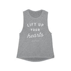 "\"Lift up your hearts\" athletic muscle style tank :: Printed with new technology - quality print :: 10% of your purchase goes to help a monthly cause :: Made in USA. sweatshop-free environment :: Lightweight fabric :: Sideseamed. Relaxed, drapey fit. Low cut armhole. Curved bottom hem. :: These shirts are not super fitted, more of a loose style For care of your new tee, it is recommended that you wash your shirt with like colors and dry inside out on low or hang dry if you have the time. Pleas Faith Tee Shirts, Ballet Fitness, Catholic Tshirts, Faith Tees, Muscle Tank Tops, Muscle Tee, Athletic Outfits, Workout Tanks, Muscle Tank