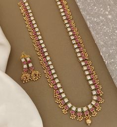 This exquisite set features a stunning pink and green necklace paired with matching earrings. Heer kemp pure Brass ruby Necklace is beautifully crafted and adorned with intricate details, while the jhumka Earrings add a touch of elegance to the overall look. Perfect for adding a pop of color to any outfit, this set is a must-have for those who appreciate quality craftsmanship and unique design. Style & Look: This stunning jewelry set features high-quality pure brass, ensuring durability and a timeless appeal. The necklace is adorned with radiant rubies, adding a touch of luxury and sophistication to any outfit. The traditional Jhumka earrings perfectly complete the set, offering a classic charm that suits both festive occasions and everyday wear. Elevate your jewelry collection with this u Traditional Jhumka, Jewelry Cleaning Solution, Ruby Necklace, Jhumka Earrings, Green Necklace, Stunning Jewellery, Cleaning Jewelry, Intricate Details, Design Style