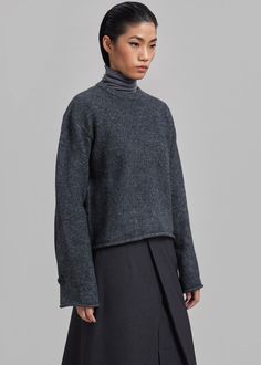 Color: Grey Melange Midweight wool blend fabric Relaxed fit Crew neckline Drop shoulders Button on sleeve Curved hemline Slip on style Unlined 39% Polyamide 31% Acrylic 30% Wool Dry Clean By Proenza Schouler White Label. Made in Turkey Frankie Shop, White Label, Proenza Schouler, Grey Sweater, Drop Shoulder, Crew Neckline, Wool Blend, Dry Clean, Slip On