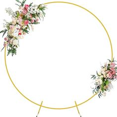 a circular frame with flowers and greenery on it