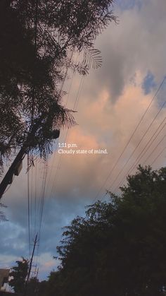 the sky is filled with clouds and some power lines are in front of it that reads, i am cloudy state of mind