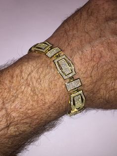 "This listing is for a stunning iced out solid 925 Sterling silver bracelet that comes in 2 finishes: rhodium (white) or 14k yellow gold finish. Bracelet is adorned with 12 carats of man-made diamond, making it super icy! Weight is approximately 30 grams and thickness is 14mm wide. 8.5\" length FREE SHIPPING IN THE US!!" Man Made Diamonds, Italian Charm Bracelet, Chain Link Bracelet, Solid 925 Sterling Silver, Sterling Silver Bracelets, Gold Finish, Silver Bracelet, Charm Bracelet, Custom Design