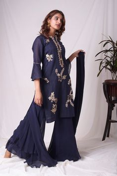 Buy cobalt blue chanderi suit online in USA. Suit has simple gotta patti work,circular flounce sleeves with delicate design,complementing palazzo and duppatta. Simple look makes it elegant.Be the talk of parties and weddings with exquisite designer gowns from Pure Elegance Indian clothing store in USA. Shop online now.-full view Indigo Chanderi Salwar Kameez With Zari Work, Blue Sharara With Gota Work For Festive, Indigo Chanderi Traditional Wear For Wedding, Blue Salwar Kameez With Gota Work For Reception, Wedding Indigo Sets With Dupatta, Blue Palazzo Set With Dabka Work In Chanderi, Indigo Wedding Sets With Dupatta, Indigo Wedding Set With Dupatta, Blue Straight Kurta Set For Reception